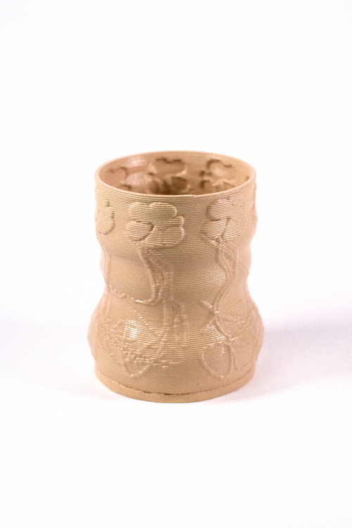 Cashew-colored 3D-printed clay matcha cup featuring a textured rooted flower pattern, designed by GLINA3.